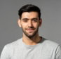 close-up-portrait-of-smiling-handsome-young-caucasian-man-face-looking-at-camera-on-isolated-light-gray-studio-background-photo.jpg